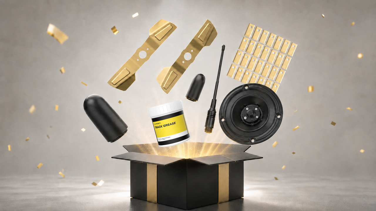 Black gift box with gold ribbon opens to reveal floating gold track parts, black speaker, grease jar, and confetti.
