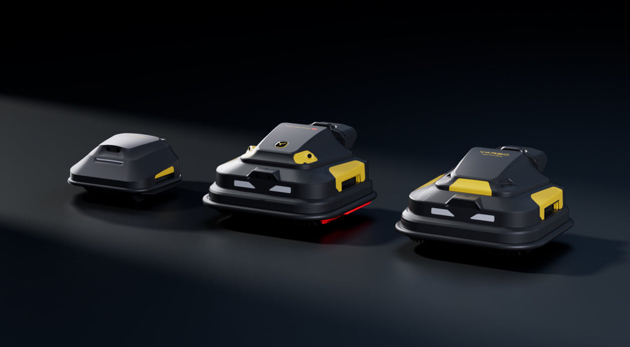 Three black and yellow YANBO robotic vacuum cleaners on dark surface, sleek design with red accent light.