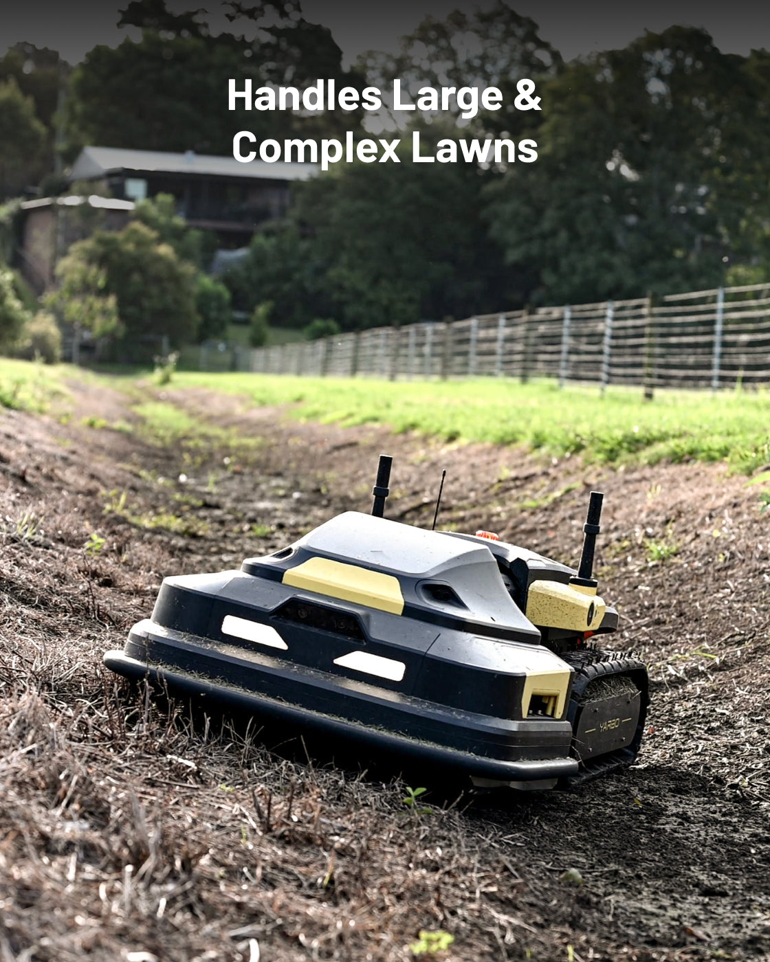 Black and yellow robotic lawn mower by Yarbo on uneven soil, side view with antennas and tracks visible