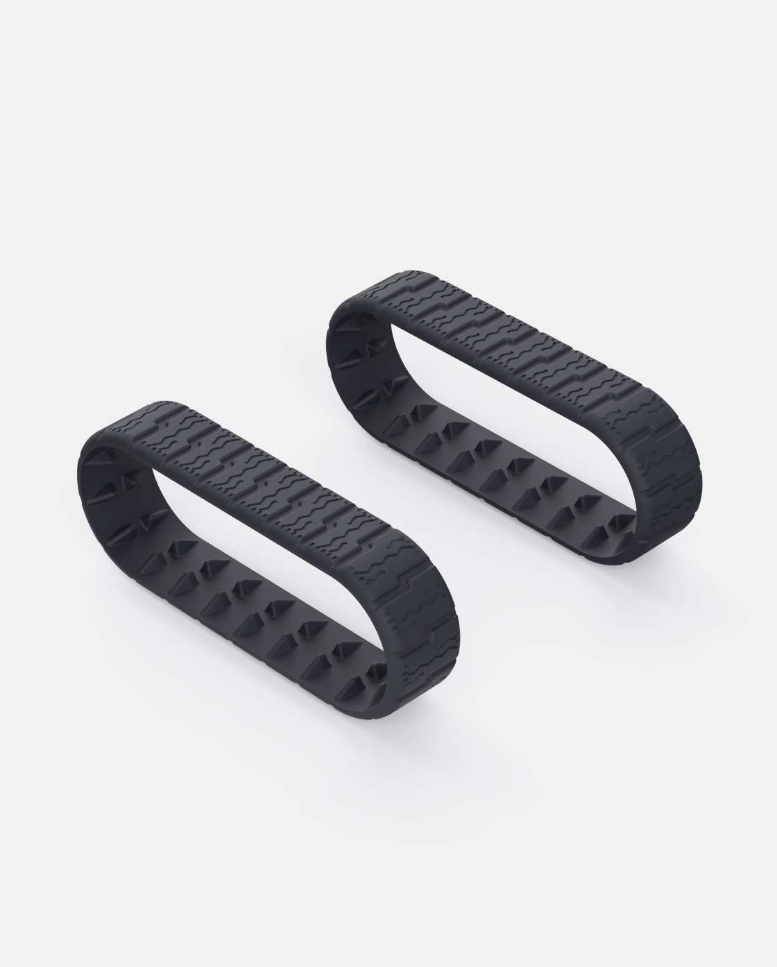 Black rubber Lawn Track (Y Series) with zigzag tread and spiked inner surface, shown in side view on white background
