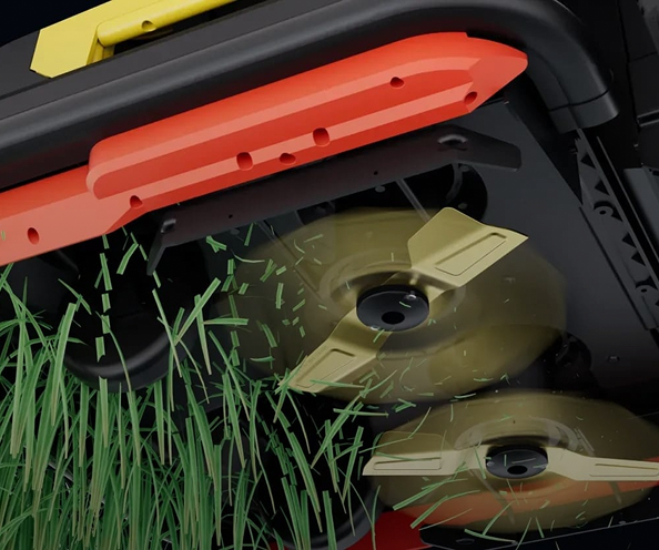 Close-up of lawnmower blades cutting green grass, with orange and black housing, gold blades, and flying clippings.