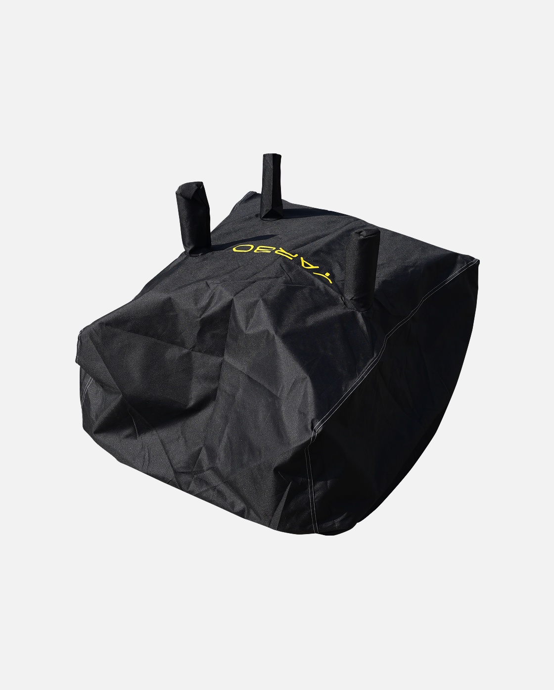 Black protective cover with yellow logo and three top handles, by YARD, shown in angled view with visible stitching and textured fabric.