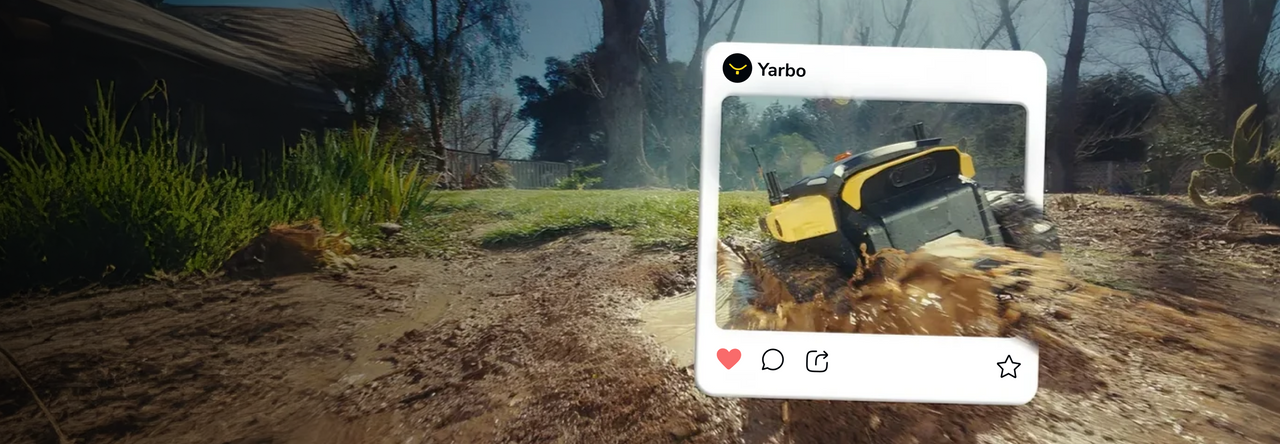Yellow and black armored vehicle splashes through mud in a rural setting, overlaid with a social media post from "Yarbo".