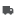 Gray silhouette of a delivery truck facing right, simple icon with rounded cab and rectangular cargo area.