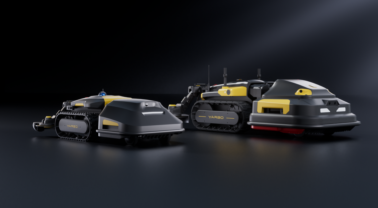 Two black and yellow YARBO tracked robots on dark surface, one with attachment, studio lighting.