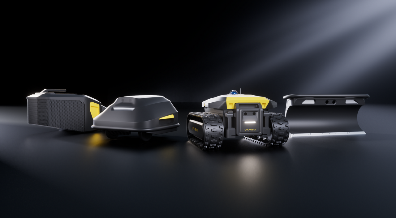 Black and yellow YARBO robot with tank treads, modular attachments, and spotlight on dark reflective surface.