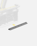 Gray metal scraper bar with bolt holes, angled view, for Y Series equipment, shown with yellow arrow pointing to attachment point on machine.