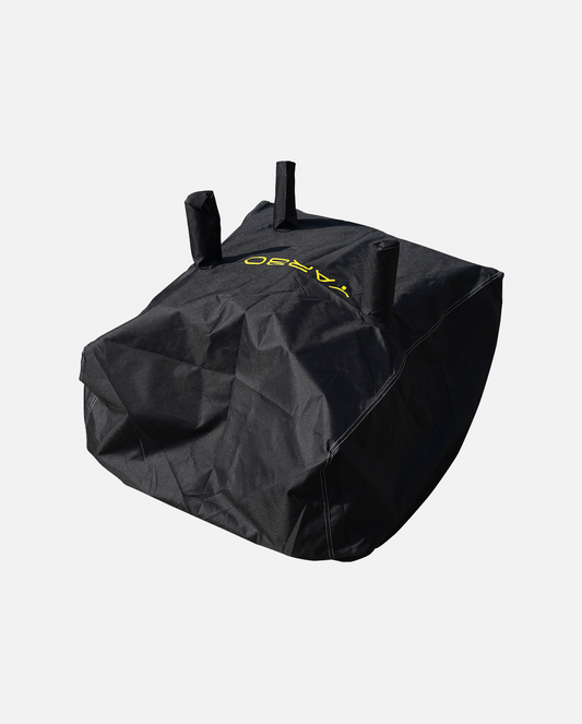 Black protective cover with yellow logo and three top handles, by YARD, shown in angled view with visible stitching and textured fabric.